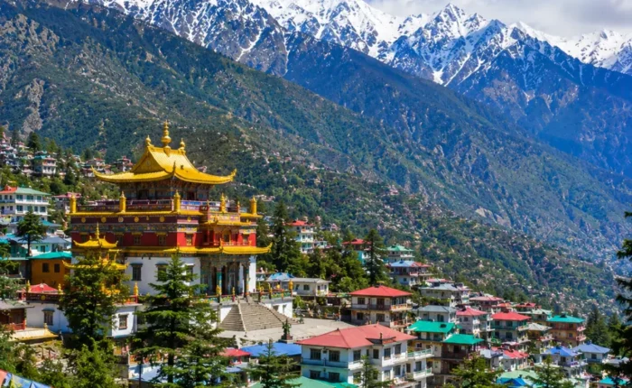 Dharamshala with Dhauladhar mountains, pine forests, Tibetan monastery and clear morning Himalayan views.