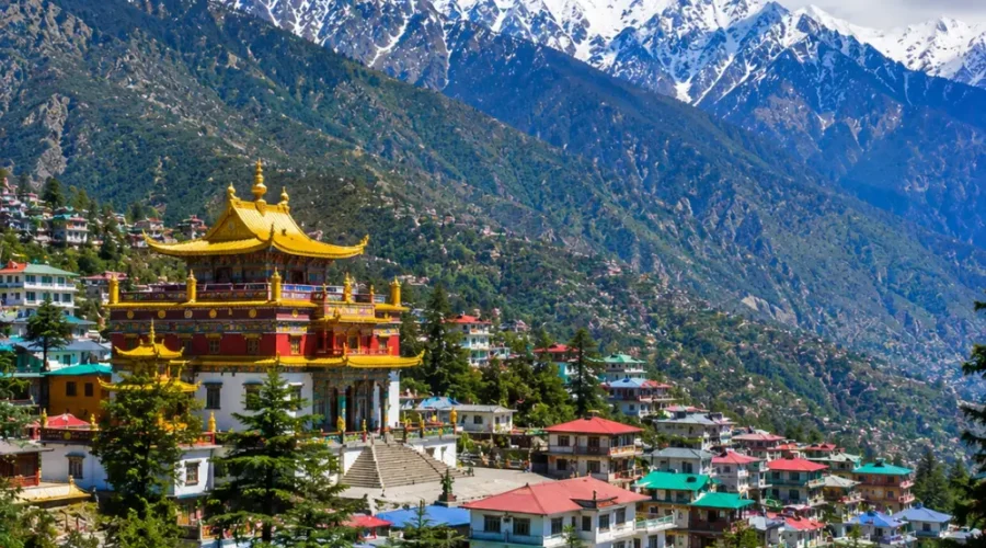 Dharamshala with Dhauladhar mountains, pine forests, Tibetan monastery and clear morning Himalayan views.