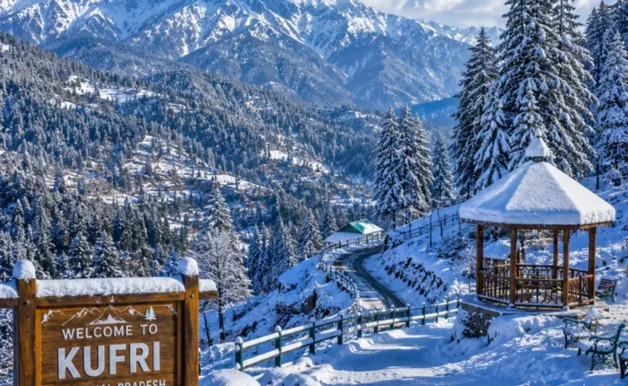 Kufri hill station with pine forests, snowy Himalayan views, green slopes and clear morning mountain scenery near Shimla.