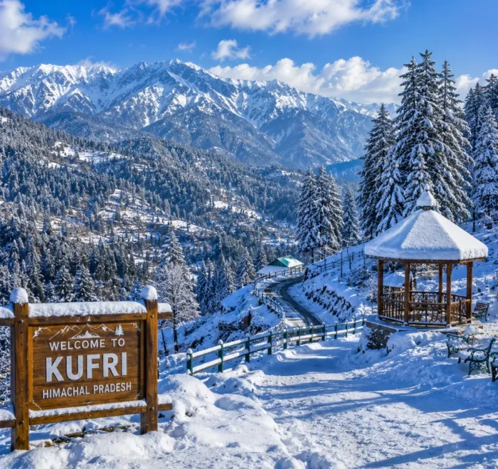 Kufri hill station with pine forests, snowy Himalayan views, green slopes and clear morning mountain scenery near Shimla.