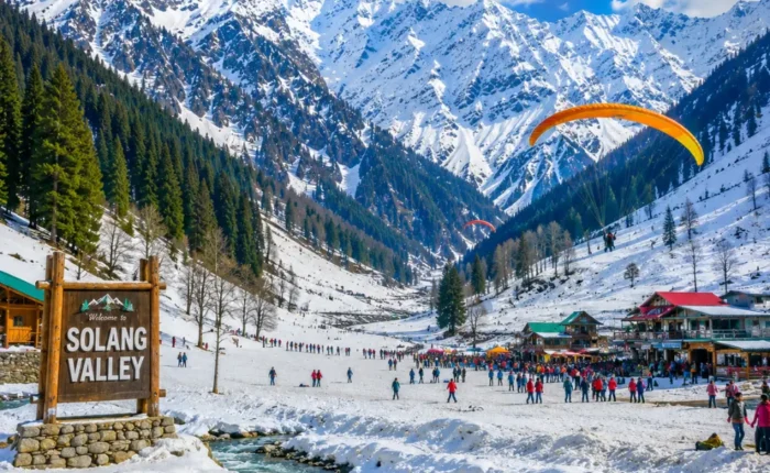 Solang Valley with snow-capped mountains, green meadows, pine forests and clear morning adventure scenery in Manali.