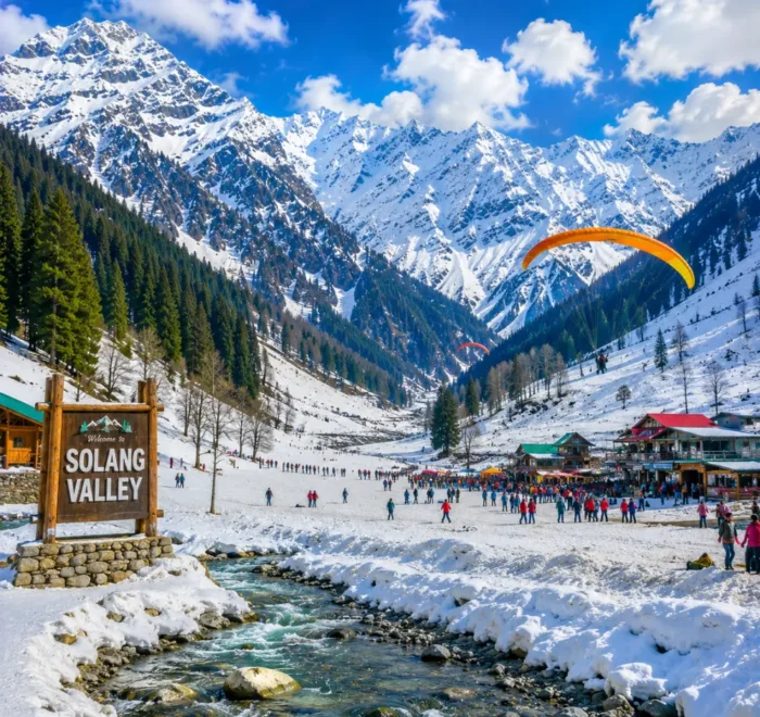 Solang Valley with snow-capped mountains, green meadows, pine forests and clear morning adventure scenery in Manali.