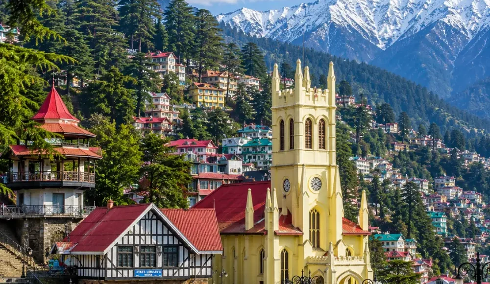 Shimla hill station with colonial buildings, pine forests, Mall Road charm and Himalayan hills in clear morning light.