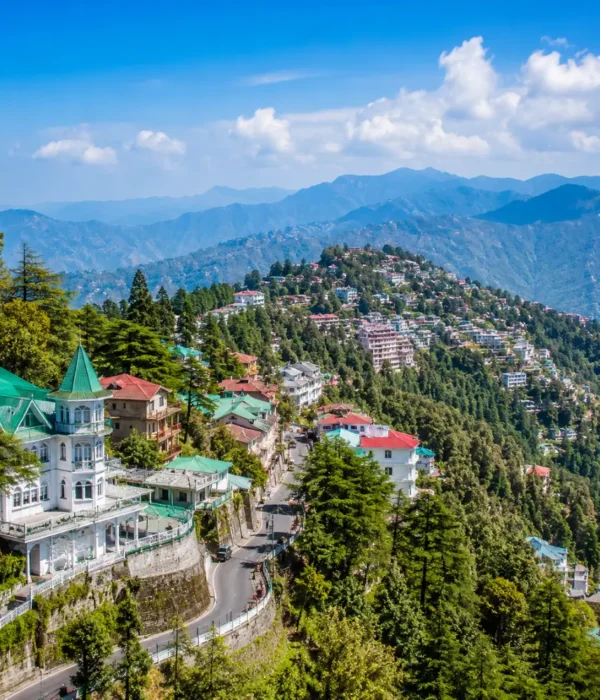 Bright morning view of Mussoorie hill station with green valleys, mountain roads, and clear Himalayan scenery