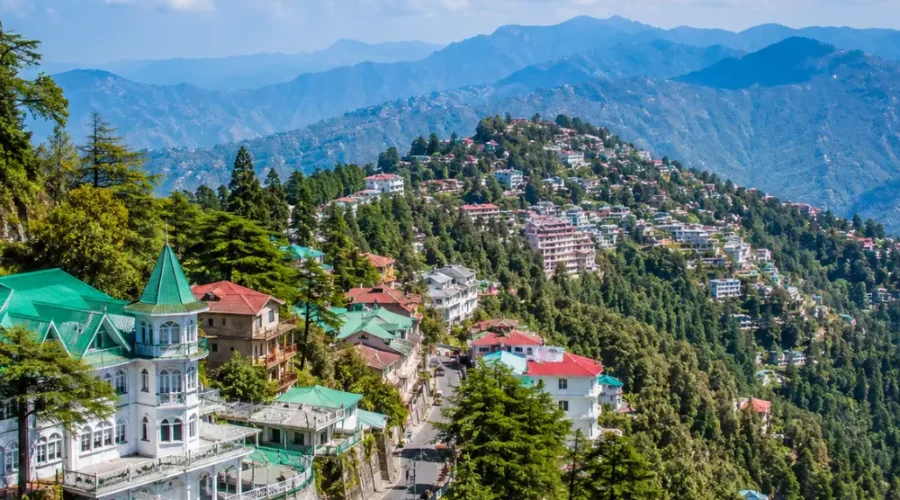 Bright morning view of Mussoorie hill station with green valleys, mountain roads, and clear Himalayan scenery