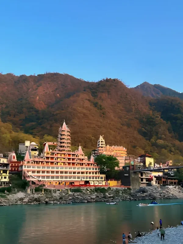 Grand Uttarakhand Explorer tour with riverfront town, mountain backdrop, scenic hills and peaceful Uttarakhand landscape