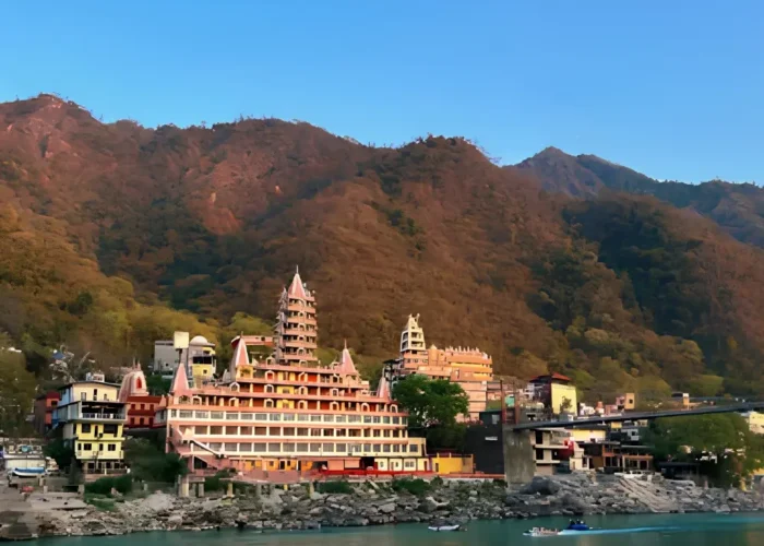 Grand Uttarakhand Explorer tour with riverfront town, mountain backdrop, scenic hills and peaceful Uttarakhand landscape