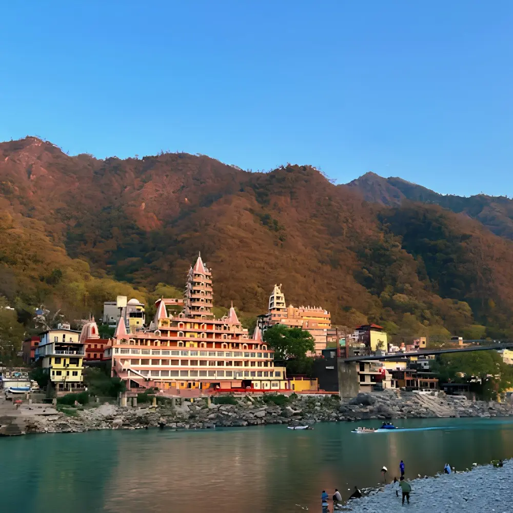 Grand Uttarakhand Explorer tour with riverfront town, mountain backdrop, scenic hills and peaceful Uttarakhand landscape