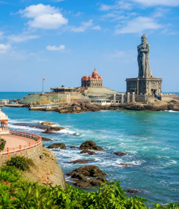 Kanyakumari seashore with Vivekananda Rock Memorial, Thiruvalluvar statue and clear morning ocean views.