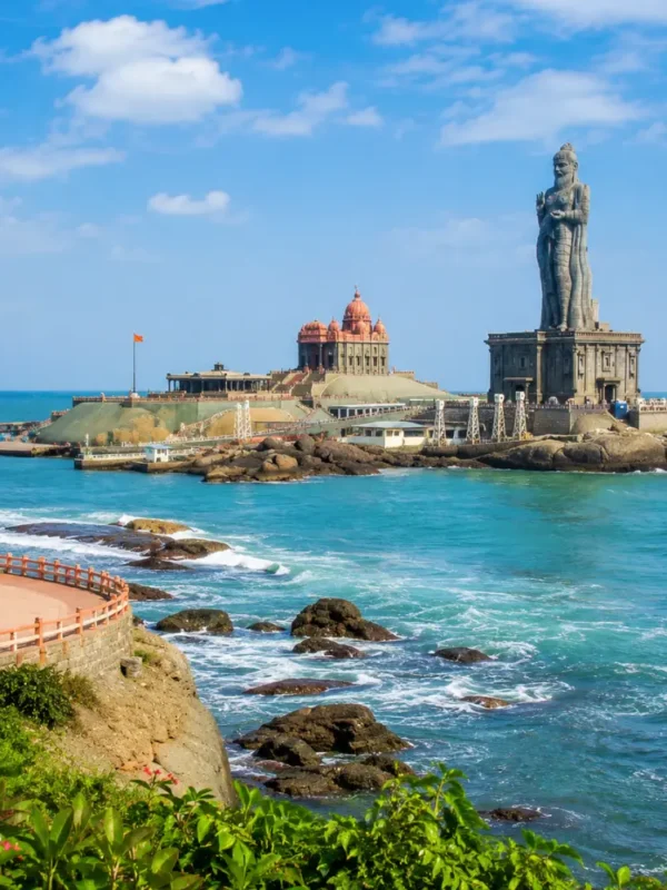 Kanyakumari seashore with Vivekananda Rock Memorial, Thiruvalluvar statue and clear morning ocean views.