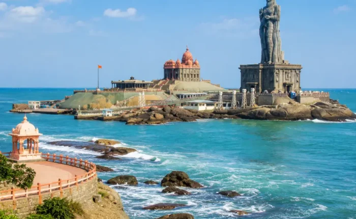 Kanyakumari seashore with Vivekananda Rock Memorial, Thiruvalluvar statue and clear morning ocean views.