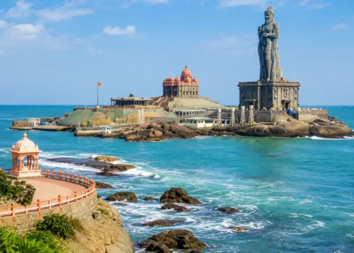 Kanyakumari seashore with Vivekananda Rock Memorial, Thiruvalluvar statue and clear morning ocean views.