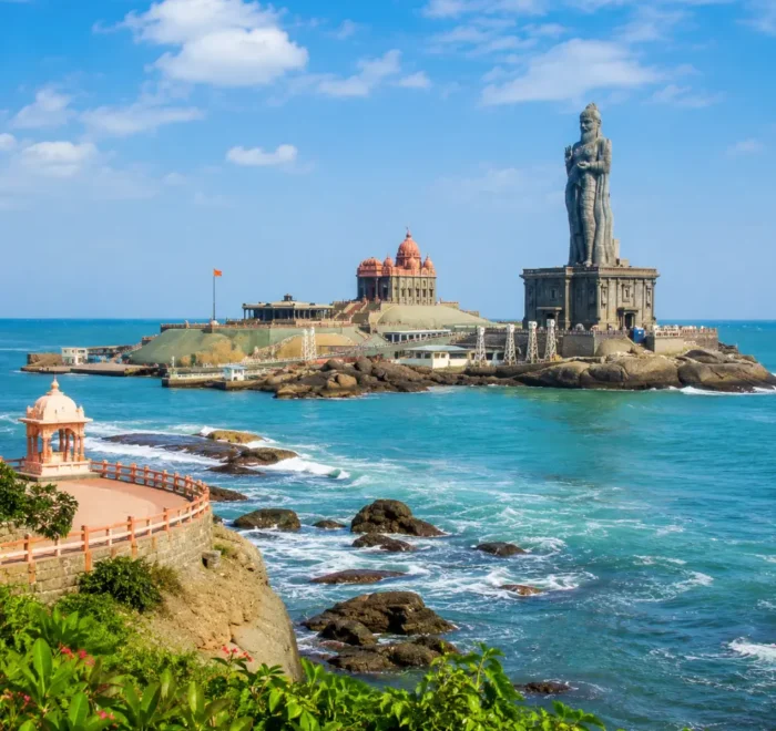 Kanyakumari seashore with Vivekananda Rock Memorial, Thiruvalluvar statue and clear morning ocean views.
