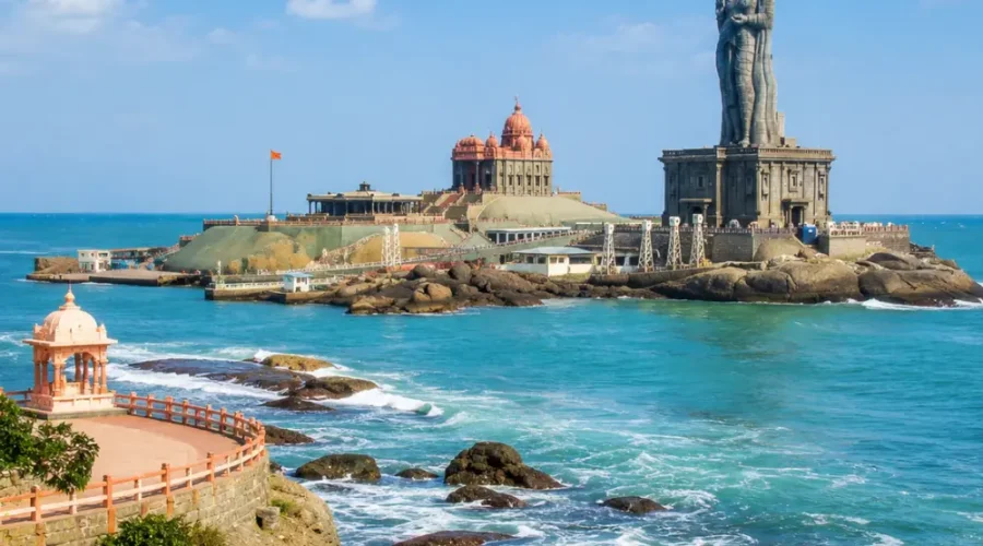 Kanyakumari seashore with Vivekananda Rock Memorial, Thiruvalluvar statue and clear morning ocean views.