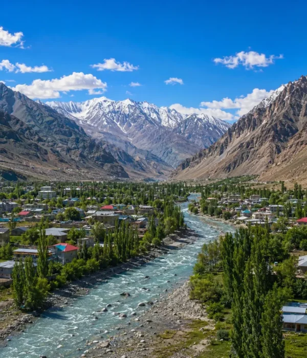 Ultra-realistic Kargil valley landscape with river, green town, snow-capped mountains, and dramatic Himalayan scenery.