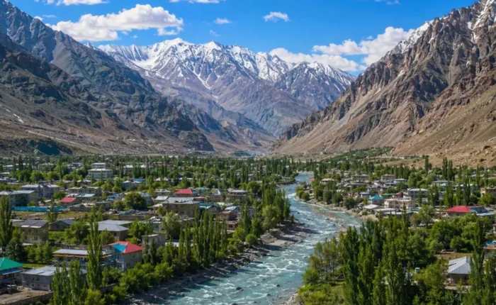 Ultra-realistic Kargil valley landscape with river, green town, snow-capped mountains, and dramatic Himalayan scenery.