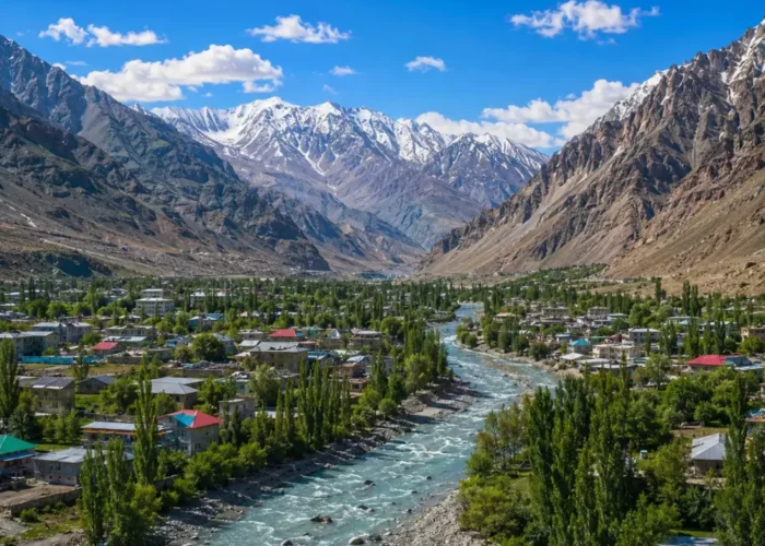 Ultra-realistic Kargil valley landscape with river, green town, snow-capped mountains, and dramatic Himalayan scenery.