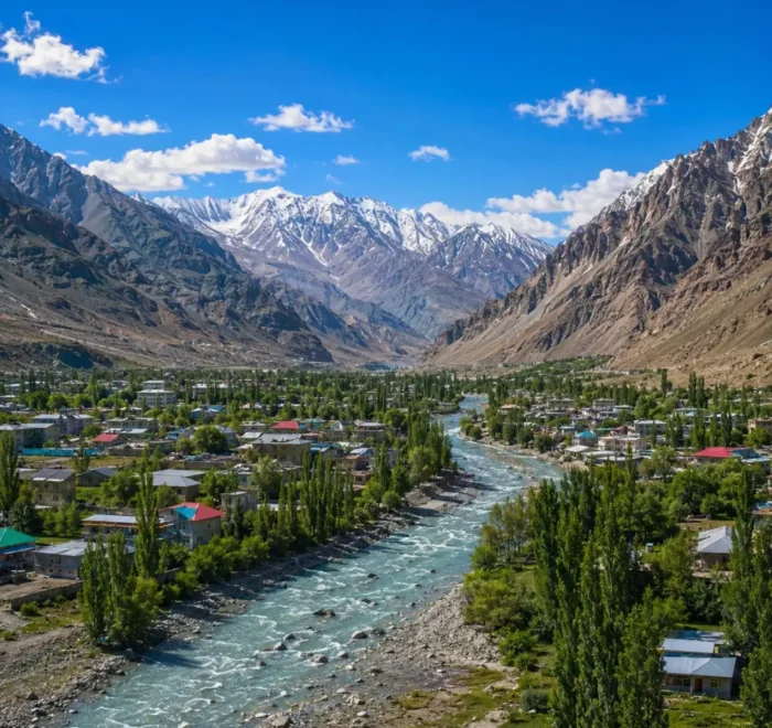 Ultra-realistic Kargil valley landscape with river, green town, snow-capped mountains, and dramatic Himalayan scenery.