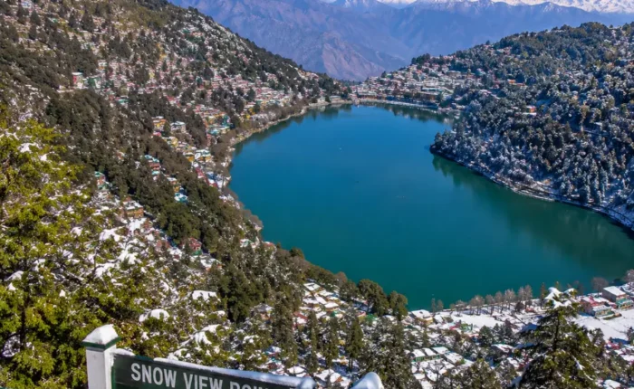 Bright morning view from Snow View Point in Nainital with Himalayan peaks, green hills, and clear mountain scenery