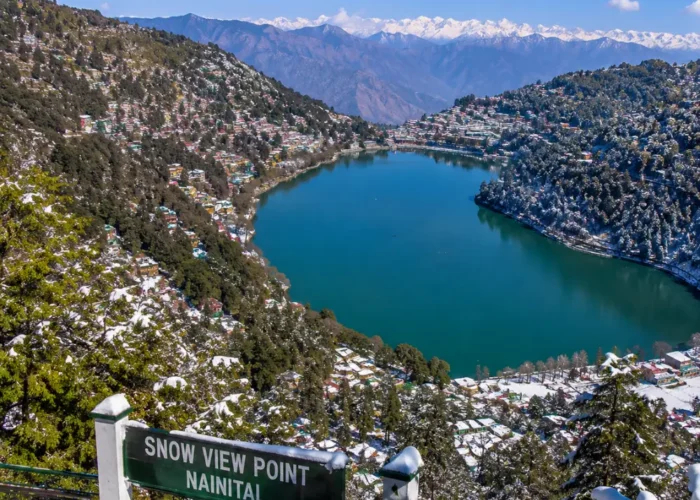 Bright morning view from Snow View Point in Nainital with Himalayan peaks, green hills, and clear mountain scenery