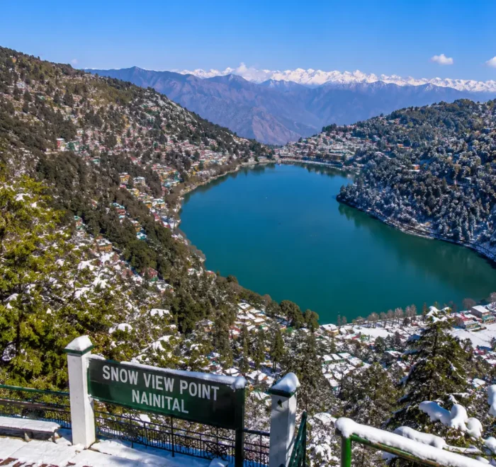 Bright morning view from Snow View Point in Nainital with Himalayan peaks, green hills, and clear mountain scenery