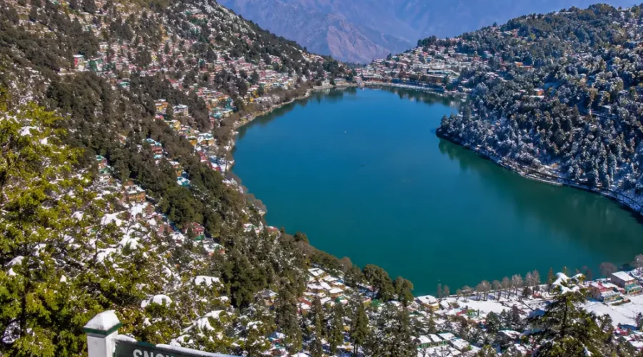 Bright morning view from Snow View Point in Nainital with Himalayan peaks, green hills, and clear mountain scenery