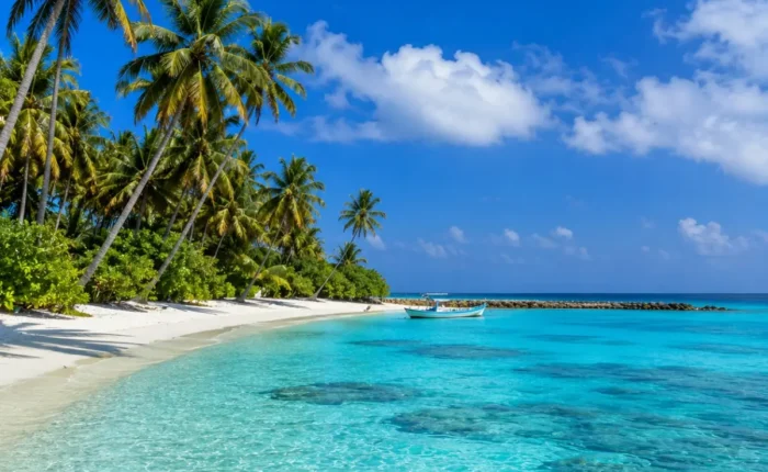 Lakshadweep Island Tour Package (4N/5D) featuring pristine beaches, turquoise lagoons, coral reefs, water sports and tropical island landscapes.