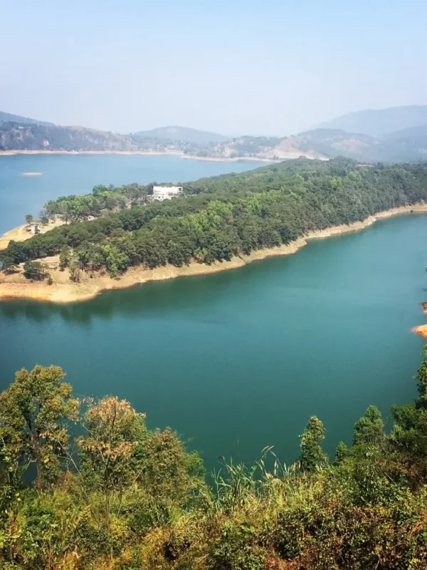 Assam Meghalaya Highlights Package with scenic lake, forested island, rolling hills and peaceful Northeast India landscape