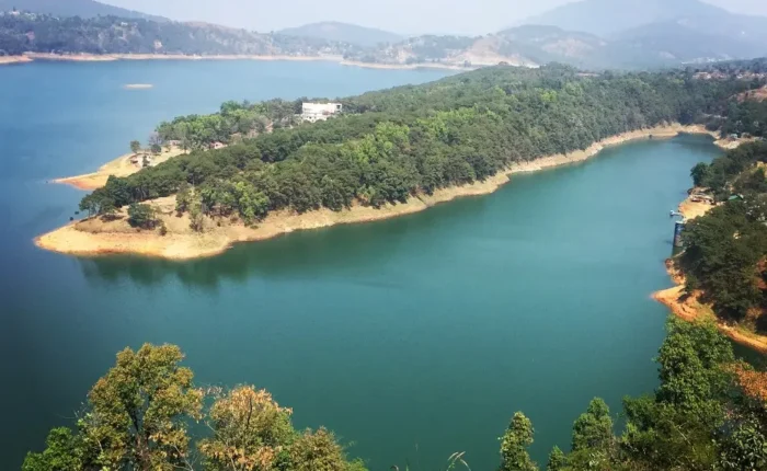Assam Meghalaya Highlights Package with scenic lake, forested island, rolling hills and peaceful Northeast India landscape