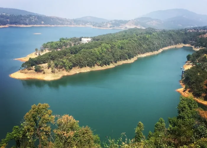 Assam Meghalaya Highlights Package with scenic lake, forested island, rolling hills and peaceful Northeast India landscape