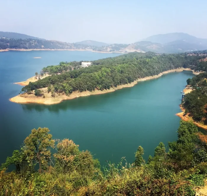 Assam Meghalaya Highlights Package with scenic lake, forested island, rolling hills and peaceful Northeast India landscape