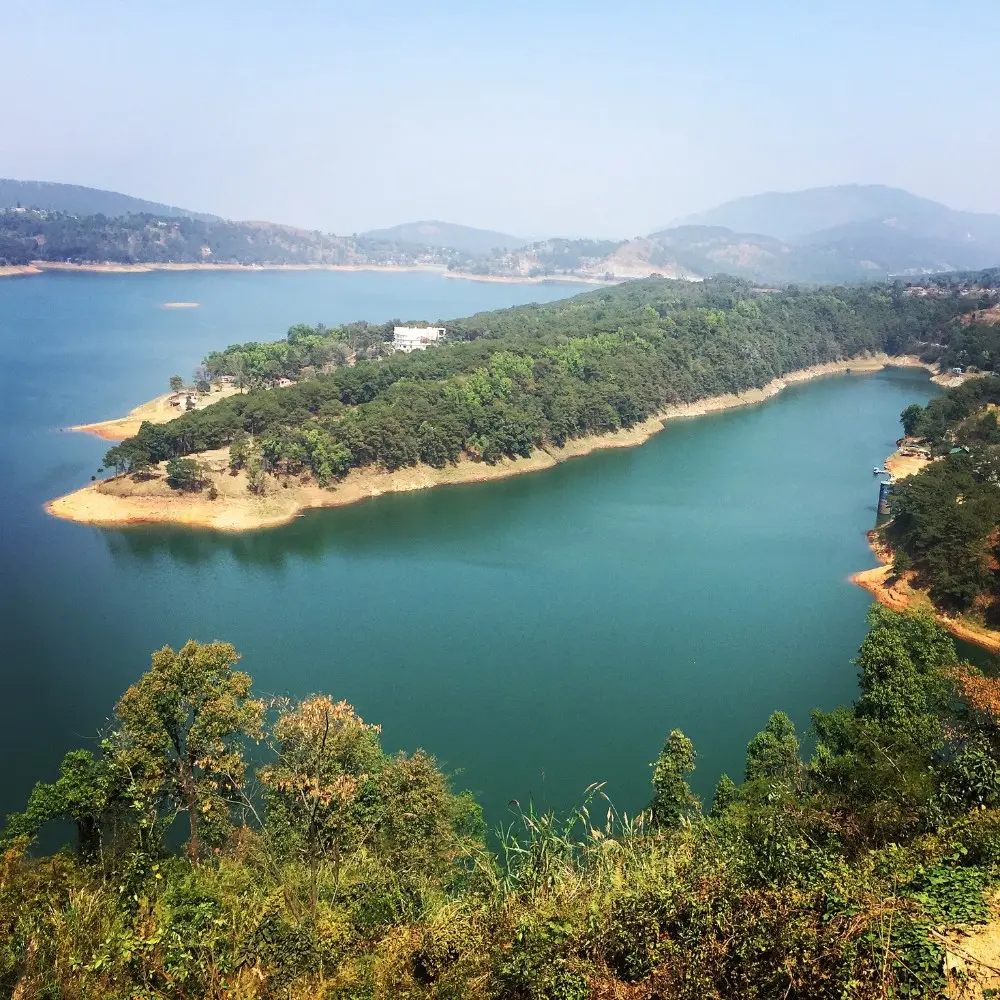 Assam Meghalaya Highlights Package with scenic lake, forested island, rolling hills and peaceful Northeast India landscape