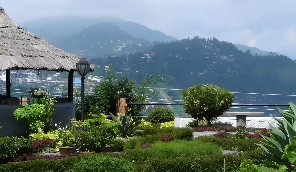 Gangtok Kalimpong Darjeeling package with scenic hill garden, misty mountains, lush greenery and peaceful Himalayan views