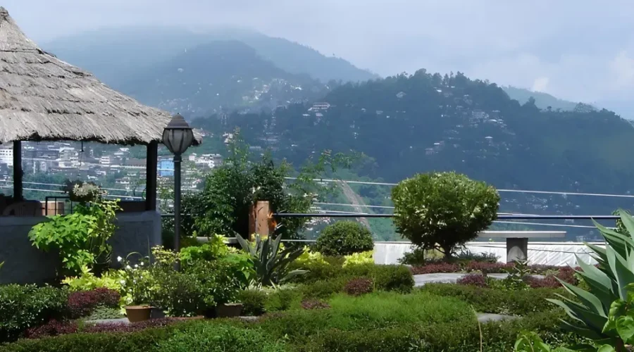 Gangtok Kalimpong Darjeeling package with scenic hill garden, misty mountains, lush greenery and peaceful Himalayan views