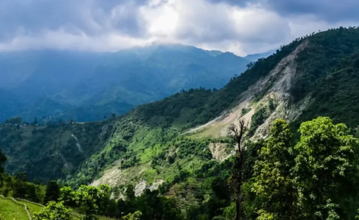 Grand West Bengal Explorer with green hills, cloudy sky, mountain valley and scenic North Bengal nature landscape