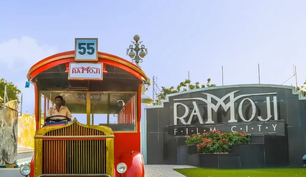 Hyderabad Family Fun Package featuring Ramoji Film City vintage bus, entrance view and family entertainment attraction