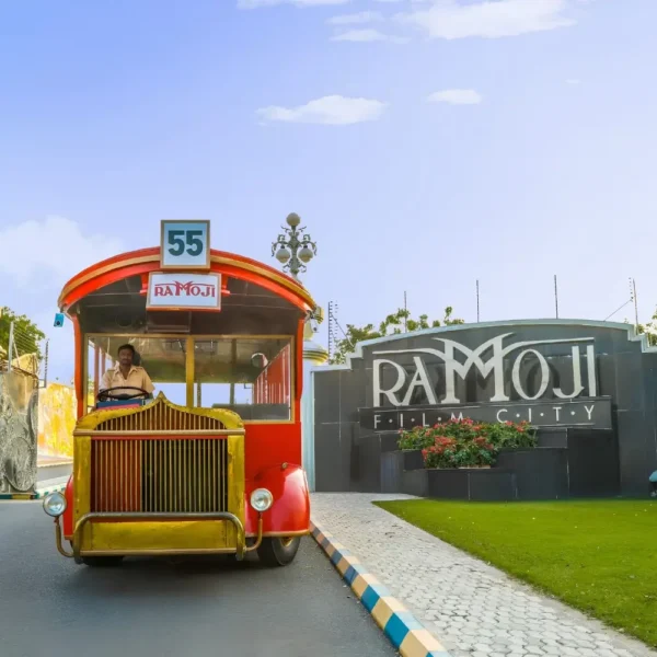 Hyderabad Family Fun Package featuring Ramoji Film City vintage bus, entrance view and family entertainment attraction