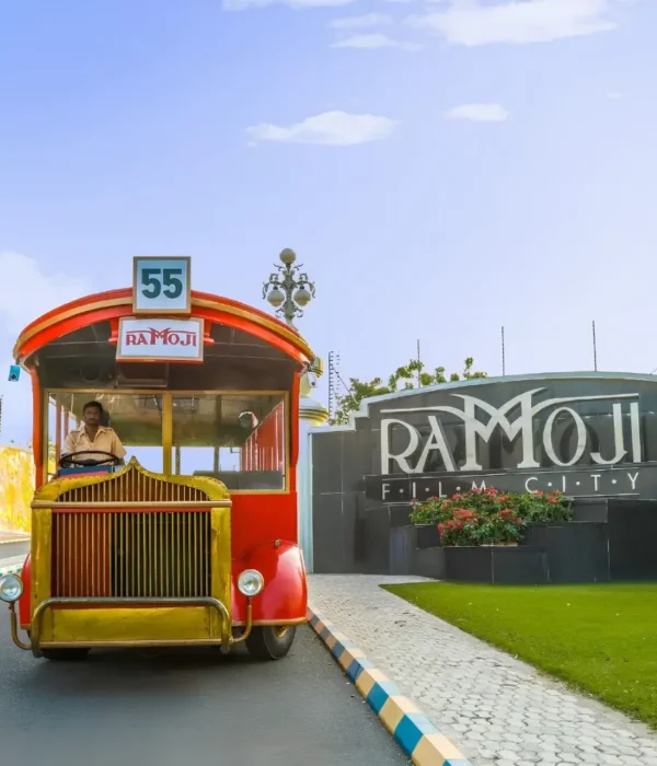 Hyderabad Family Fun Package featuring Ramoji Film City vintage bus, entrance view and family entertainment attraction