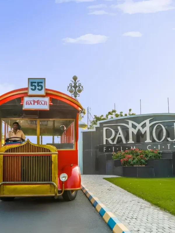 Hyderabad Family Fun Package featuring Ramoji Film City vintage bus, entrance view and family entertainment attraction