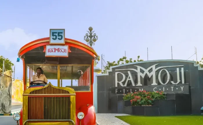 Hyderabad Family Fun Package featuring Ramoji Film City vintage bus, entrance view and family entertainment attraction
