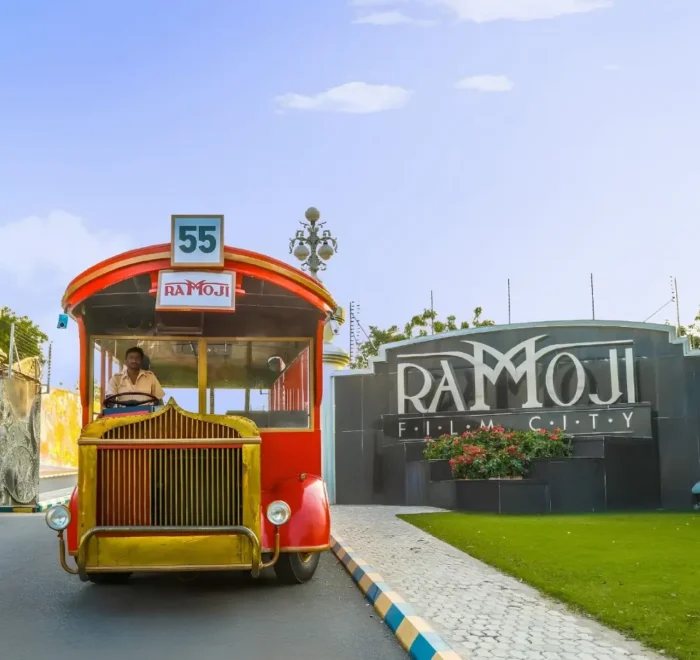 Hyderabad Family Fun Package featuring Ramoji Film City vintage bus, entrance view and family entertainment attraction