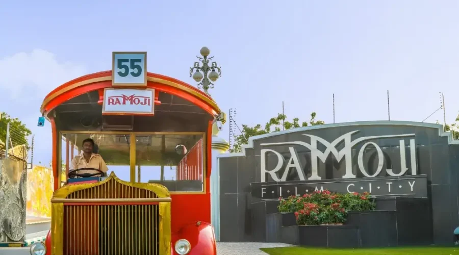 Hyderabad Family Fun Package featuring Ramoji Film City vintage bus, entrance view and family entertainment attraction