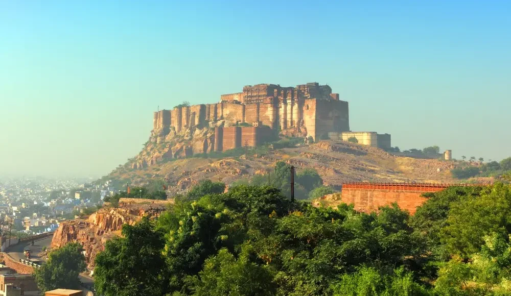 Jaipur Jodhpur Udaipur package featuring Mehrangarh Fort, heritage architecture and scenic Rajasthan city landscape