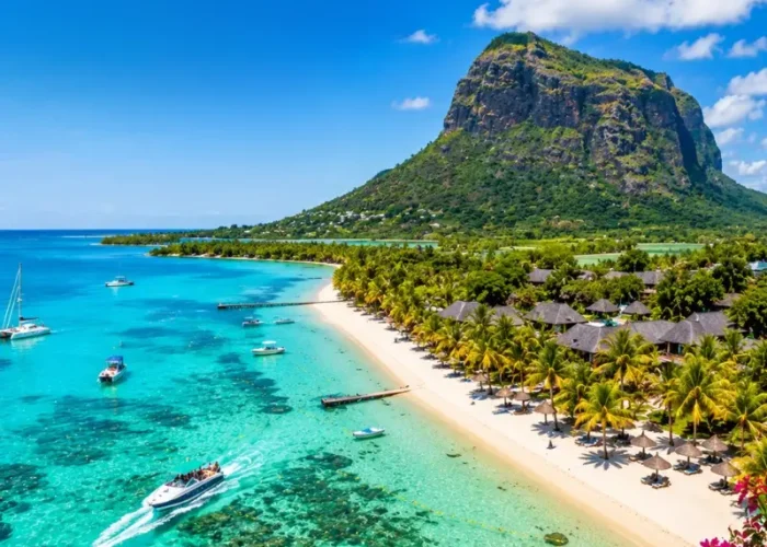 Mauritius tropical beach with turquoise lagoon, luxury shoreline and Le Morne mountain in bright daylight
