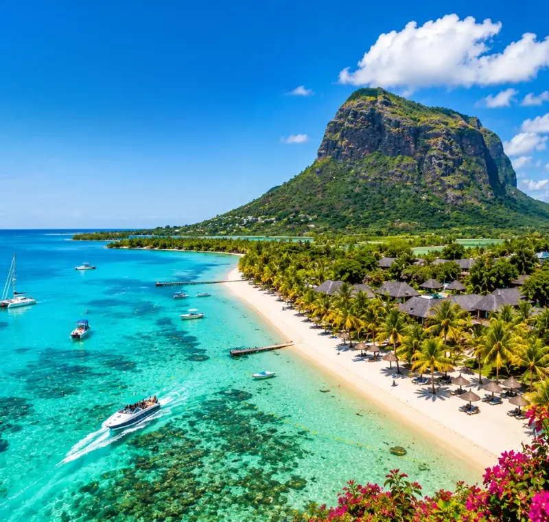 Mauritius tropical beach with turquoise lagoon, luxury shoreline and Le Morne mountain in bright daylight