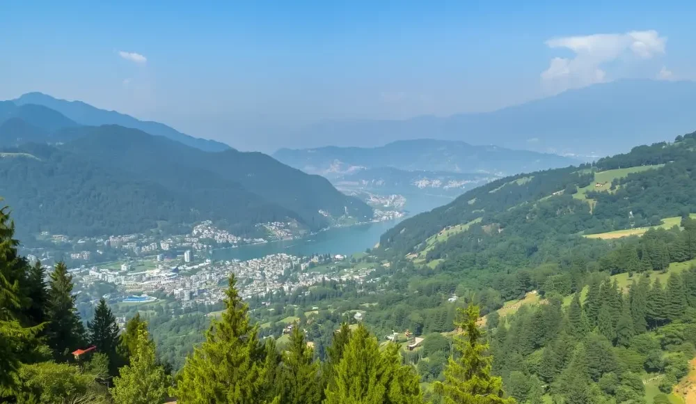 Scenic view of Nainital with green hills, pine forest, lake valley and peaceful Uttarakhand mountain landscape
