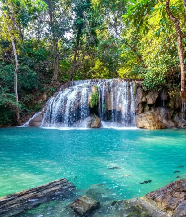 Pachmarhi hill station package image featuring a scenic waterfall and turquoise natural pool surrounded by lush forest