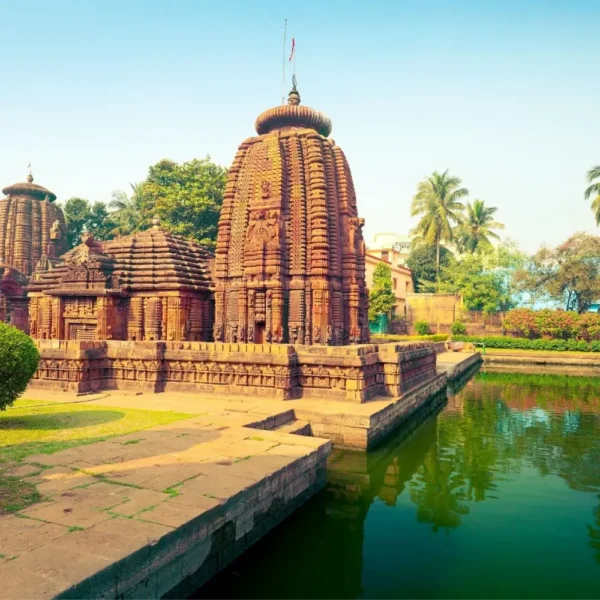 Puri Konark Chilika package image showing an ancient Odisha temple beside a serene water tank and lush greenery