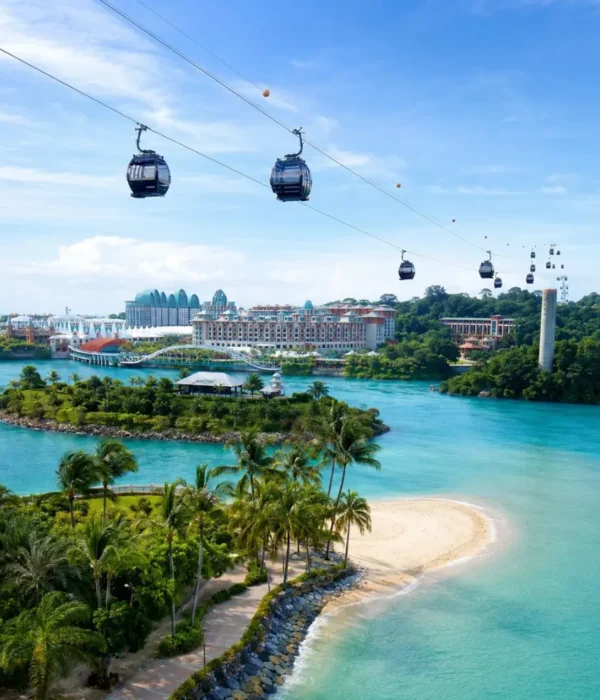 Sentosa Island Singapore with cable cars, turquoise sea, palm beach, and resort skyline in bright morning light.