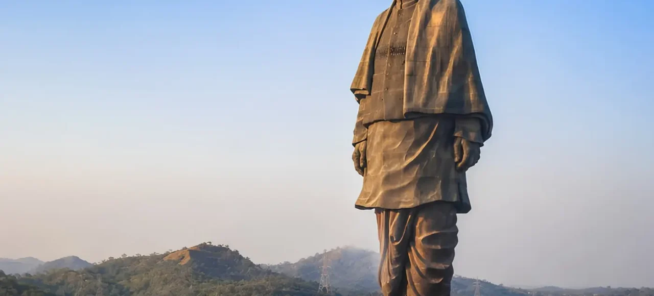 Statue of Unity in Kevadia Gujarat overlooking the Narmada River with scenic hills and iconic monument view